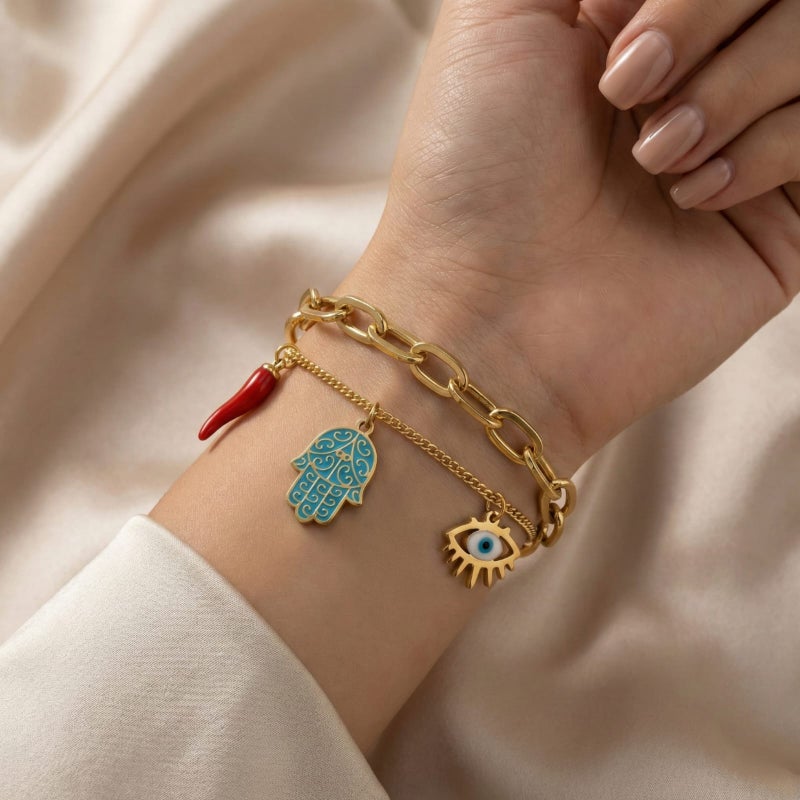 A gold bracelet made of rust-resistant stainless steel, with a design that combines blue palm, eye, and attractive red pepper charms, with an adjustable clasp to suit you. - Image 2